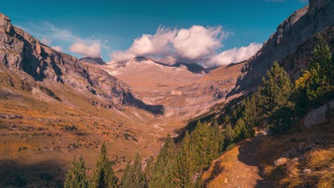 Mountain-valley-timelapse-during-fall-season-in-ordesa-national-park-beautiful-colors-and-blue-sky-with-white-clouds