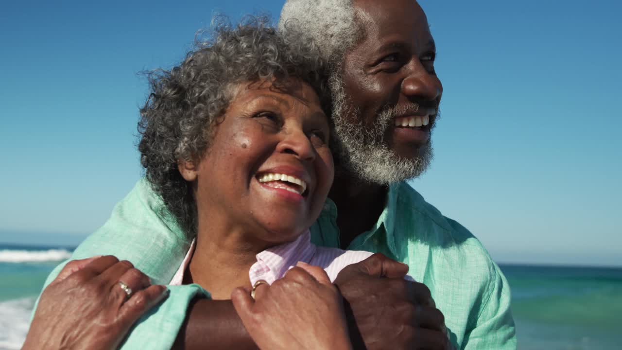 Senior couple hugging at the beach