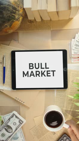 vertical video of bull market displaying on finance tablet screen