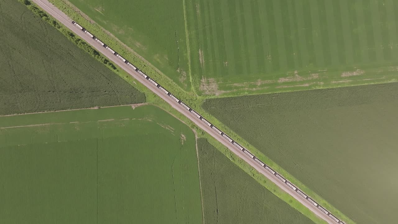 Aerial view of a train traveling through agricultural fields