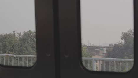 moving delhi metro crossing neighbourhood