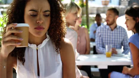 woman having coffee at restaurant