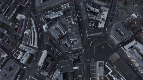 aerial birds eye overhead top down view of buildings in city. tilt up reveal of modern skyscrapers in financial borough. frankfurt am main, germany