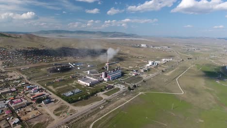 coal plants in action aerial drone shot in mongolia sunny day