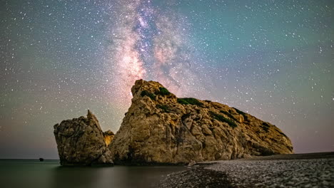 aphrodite's rock near kouklia, cyprus as the milky way crosses the sky - time lapse