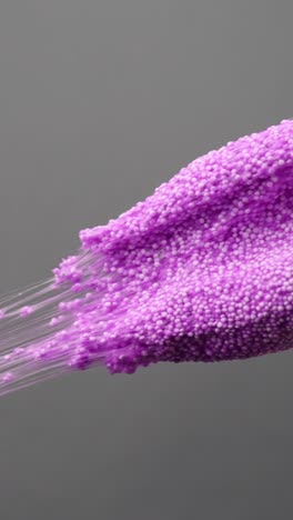 close-up of purple floam stretched vertically, playful mood, texture focus, vertical