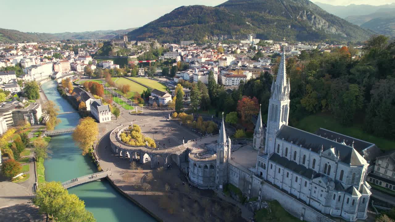 Lourdes Sanctuary aerial view with river and vibrant autumn landscape