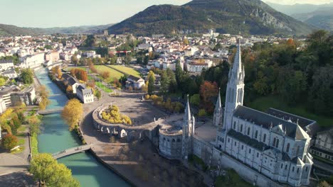 lourdes sanctuary aerial view with river and vibrant autumn landscape