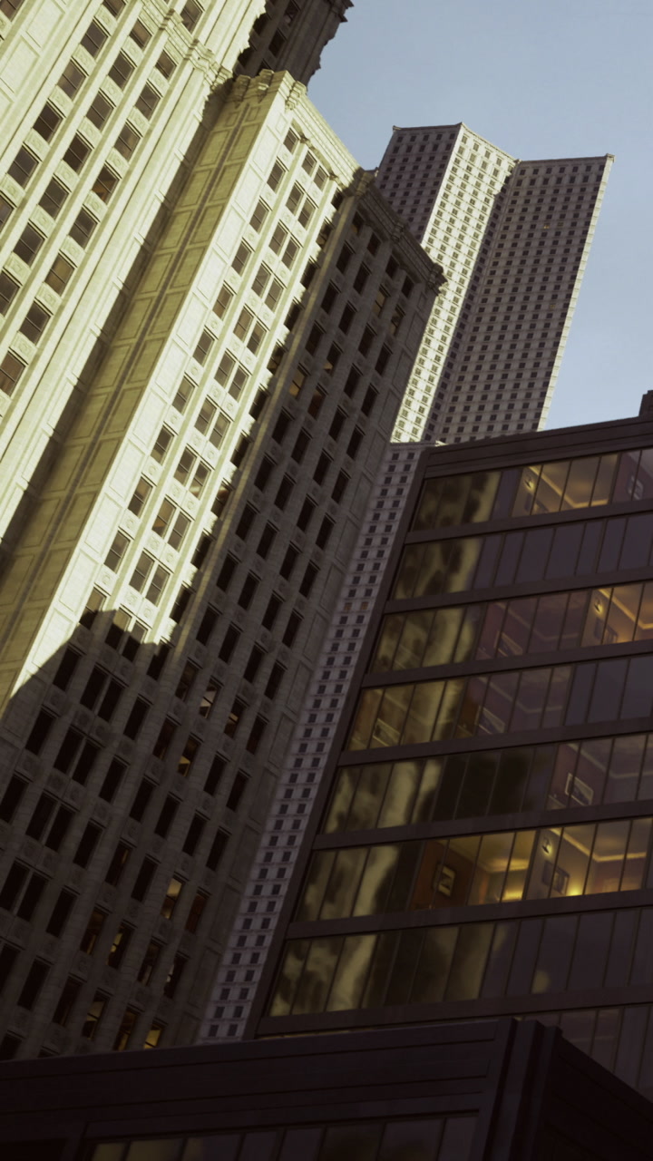 Tall buildings cast shadows in the city during a sunny afternoon