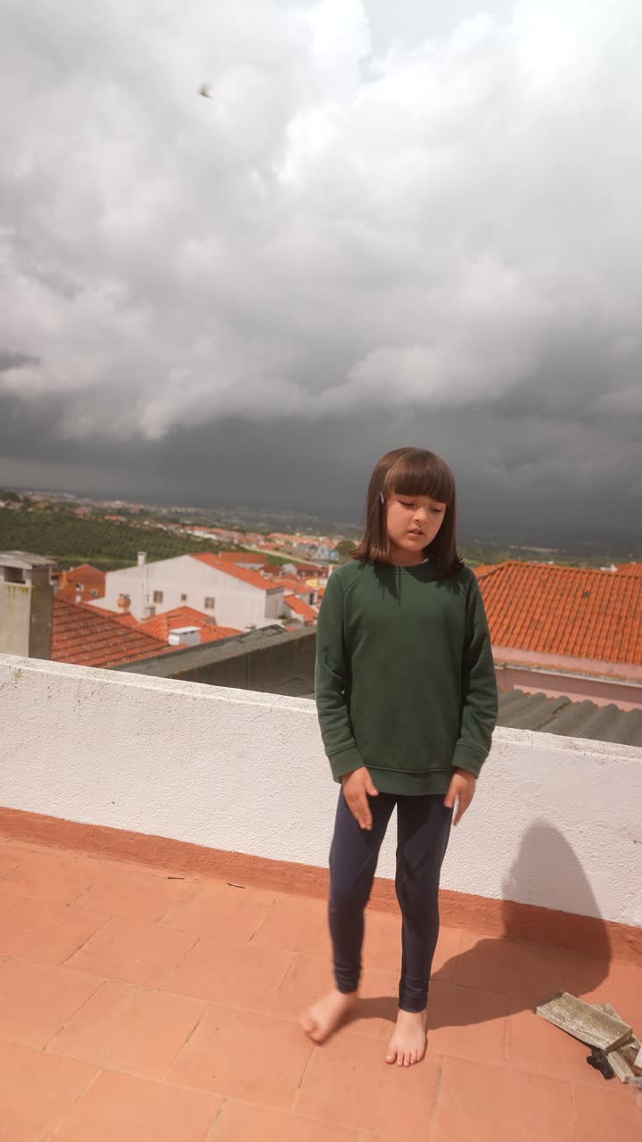 Girl Posing on a Rooftop on a Cloudy Day