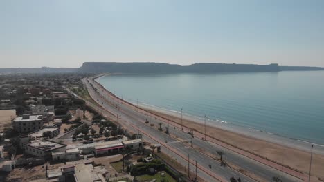 Aerial-zoom-in-shot-of-street-and-beach-of-Gwadar-Balochistan