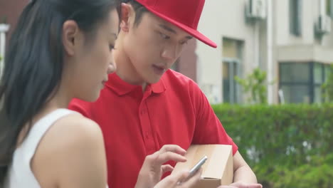 delivery man uniform smiles during express, courier holding a small package parcel delivering goods to customer's home with van truck, door-to-door services