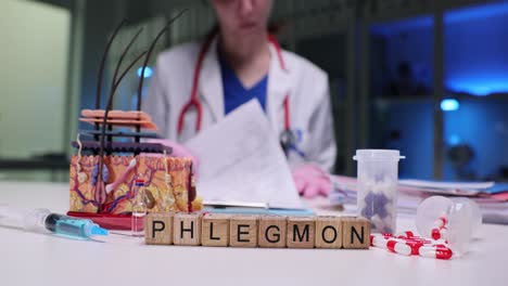 medical professional with phlegmon blocks and various medical supplies