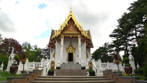 Zoom-in,-walking-towards-a-small-and-hidden-Buddhist-Thai-Temple