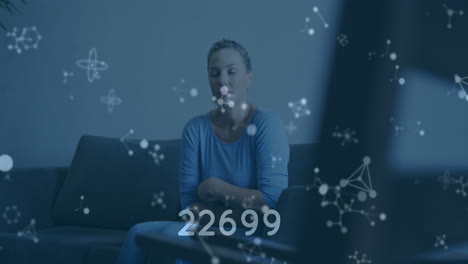 animation of medical data processing over caucasian woman on couch