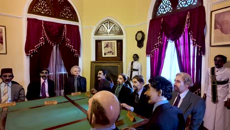 wax figures of historical leaders in a meeting