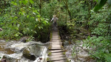 Woman-traveler-walking-on-footpath-above-river