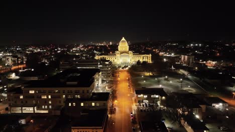 arkansas state capitol building at night in little rock, arkansas with drone video pulling back