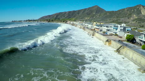 aerials over waves crashing into the california coast during a big storm 3