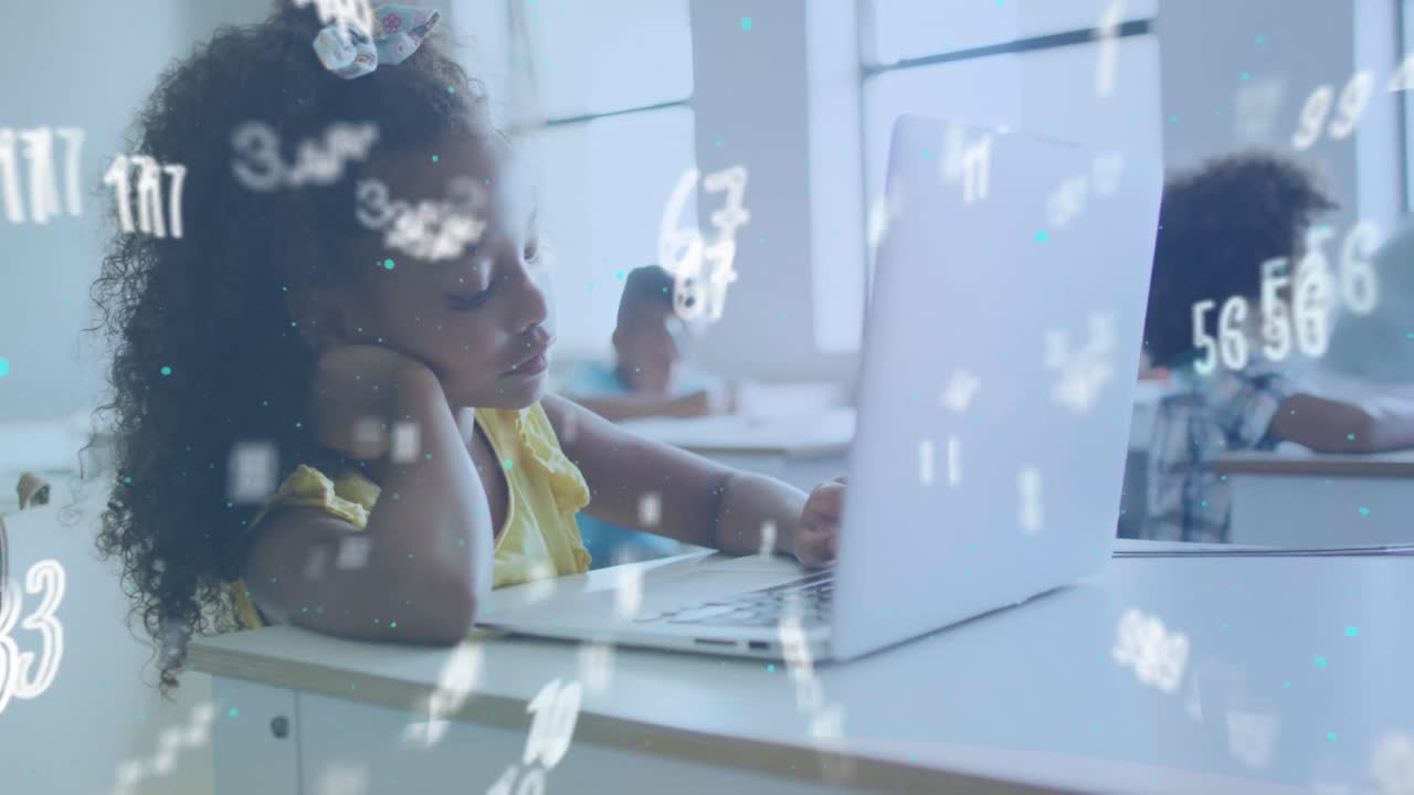 Animation of numbers moving over biracial schoolgirl using laptop at desk in class