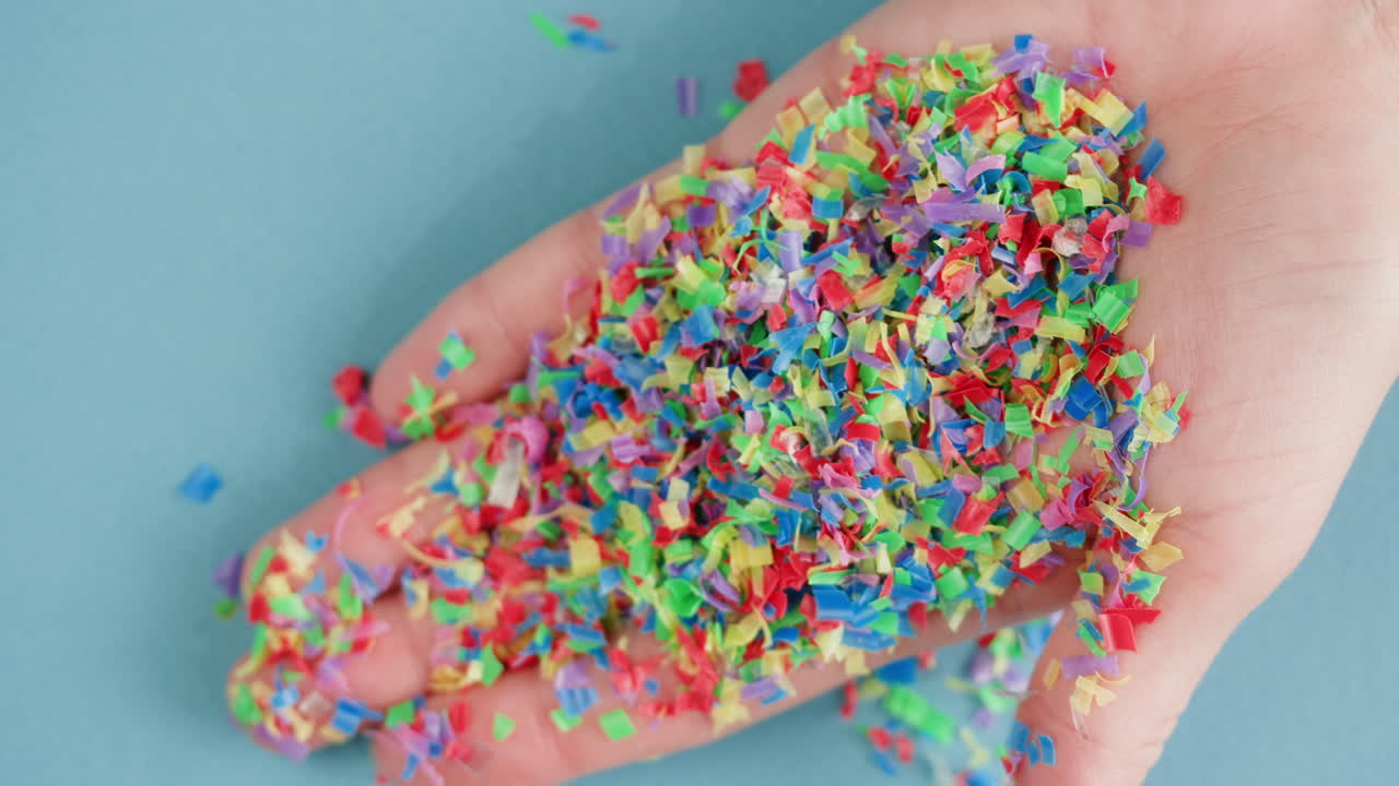 Colorful Plastic Confetti in Hand