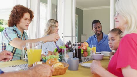 Video-of-diverse-family-spending-time-together-and-having-dinner