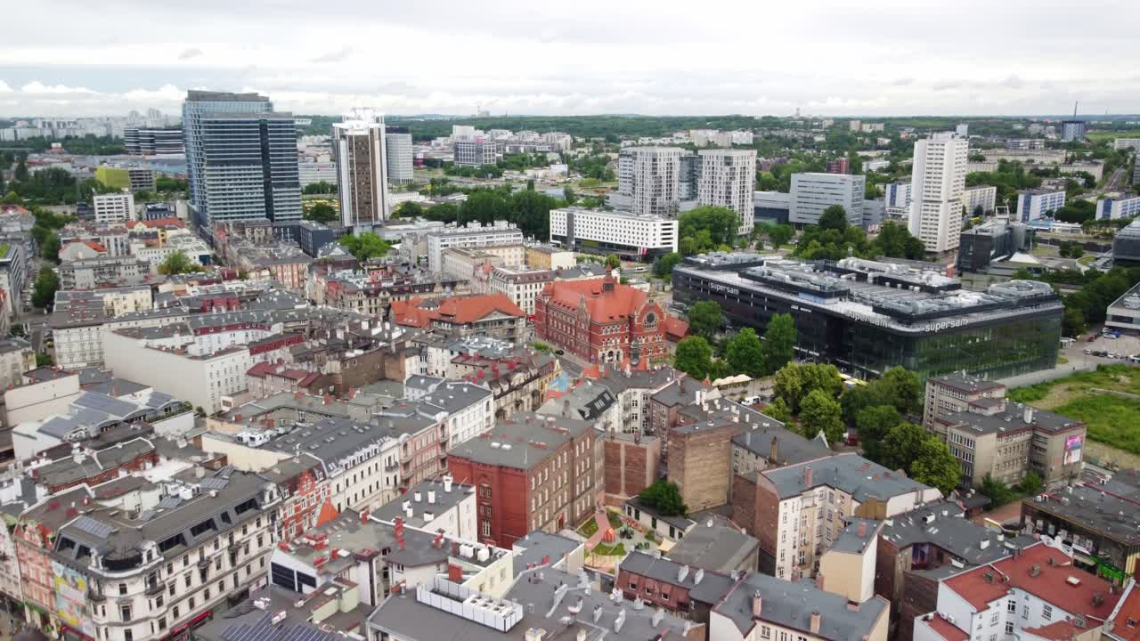 Aerial view of a city with a mix of old and modern buildings