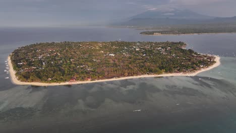 aerial wide of gili air island and lombok with mt rinjani on background. travel indonesia.