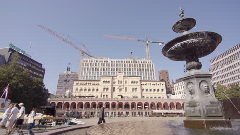 new government quarter construction viewed from youngstorget fountain, torggata