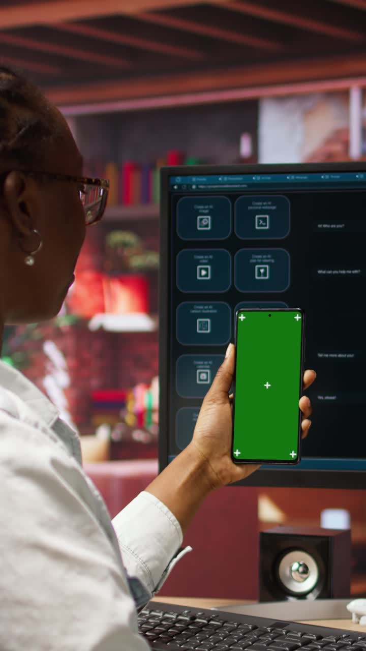 Vertical video Woman uses mockup phone, doing videocall in front of PC screen with AI chatbot