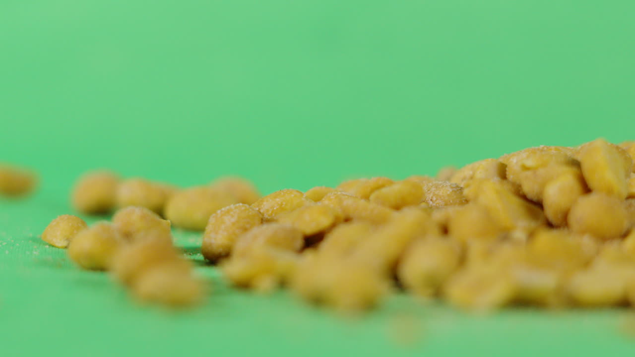 Pile of Peanuts with Green Screen Background. Isolated Healthy Food Footage Ready to Key. ProRes 4K.