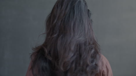 smiling man with long hair
