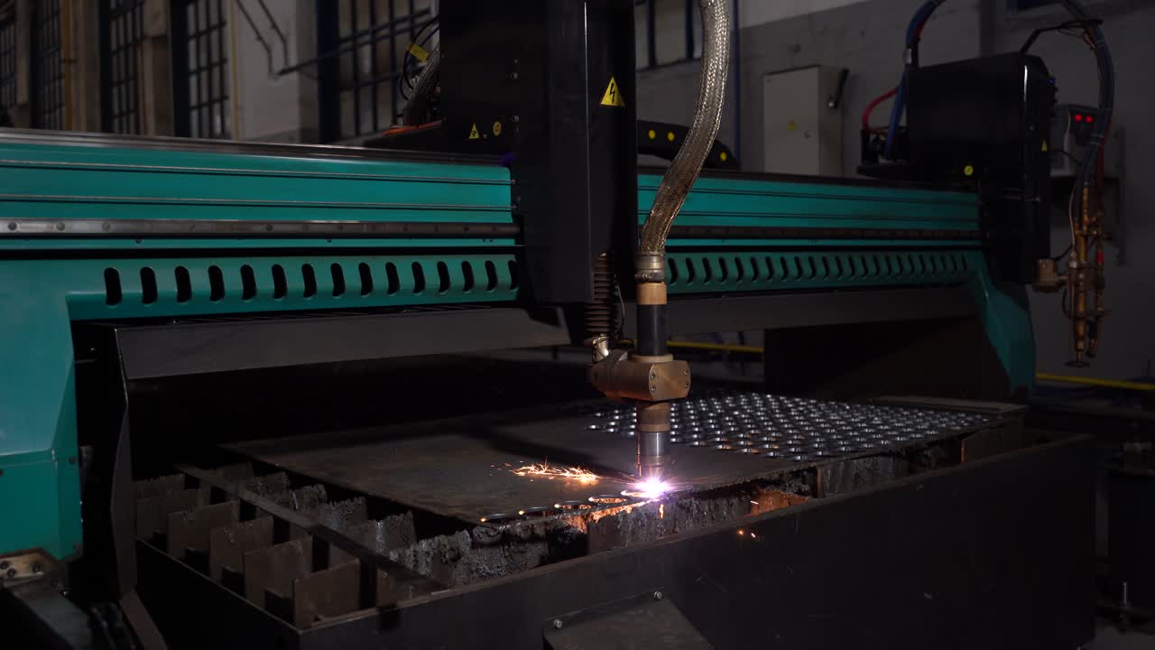 Laser cutter cuts metal parts. Industrial machine CNC. Plasma laser processing manufacture technology. Automatic work for ironwork.