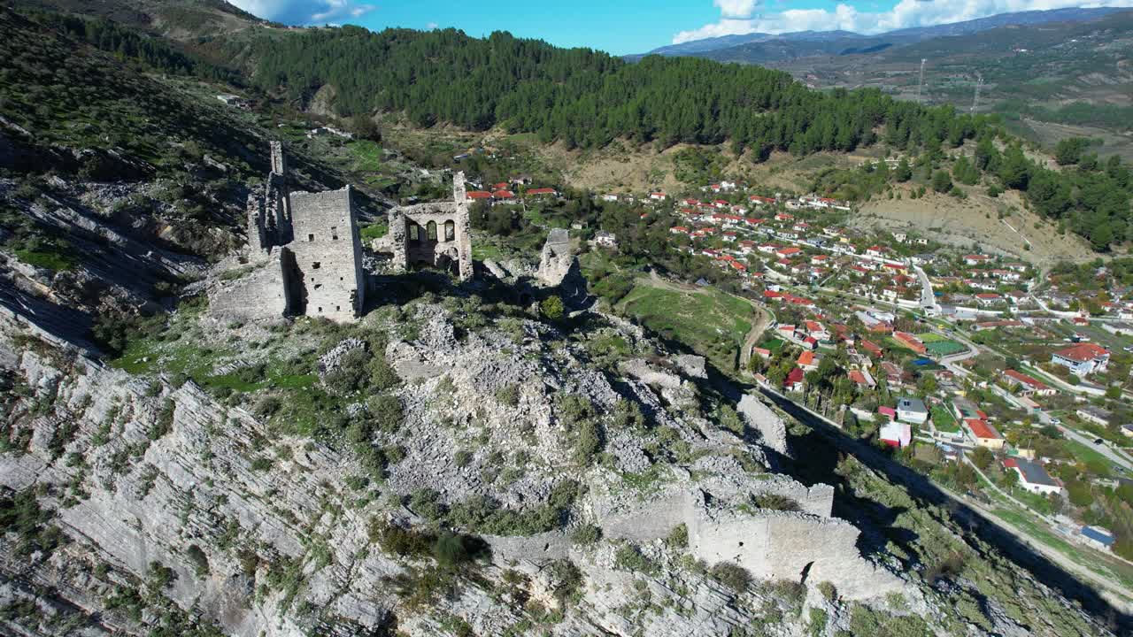 Exploring Këlcyrë Castle: Tourists Visiting Ancient Stone Palace Ruins Above Vjosa River