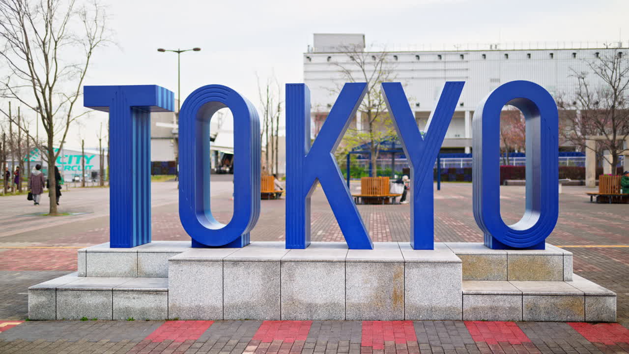 Tokyo writing in blue sign in Daiba, Japan in daylight