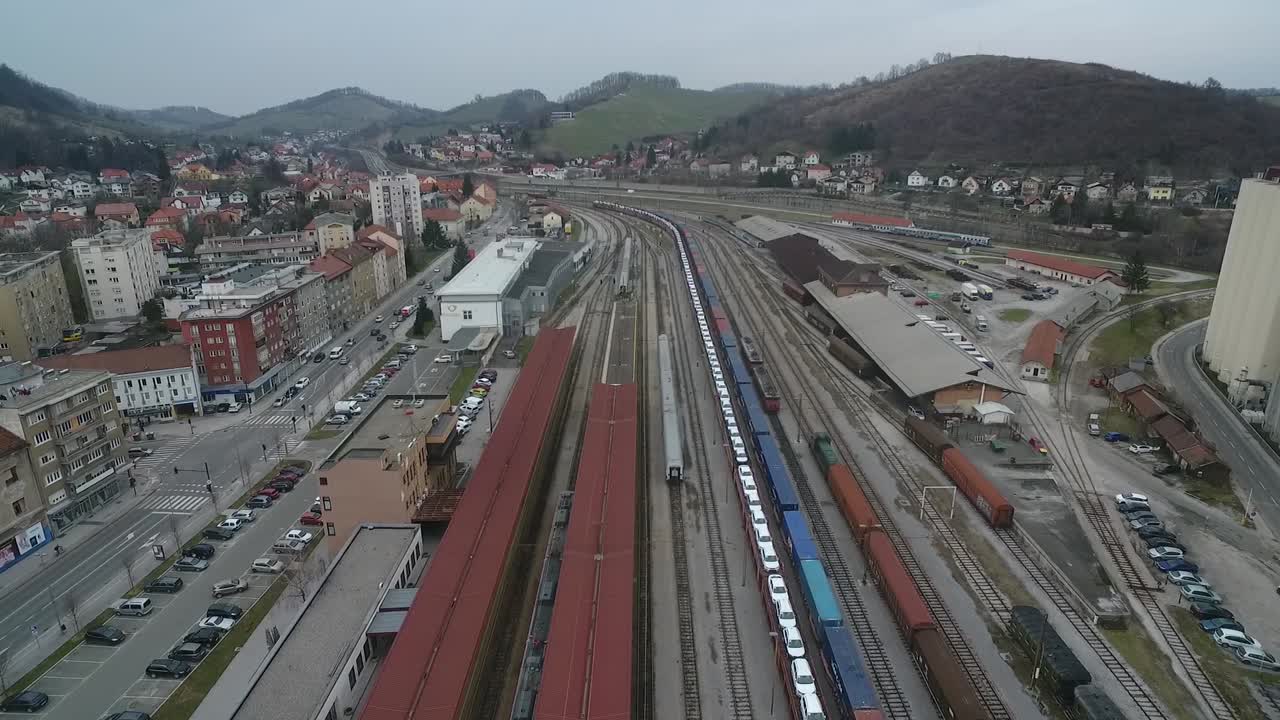 Aerial overhead view of train station and freight trains and tracks at a rail yard