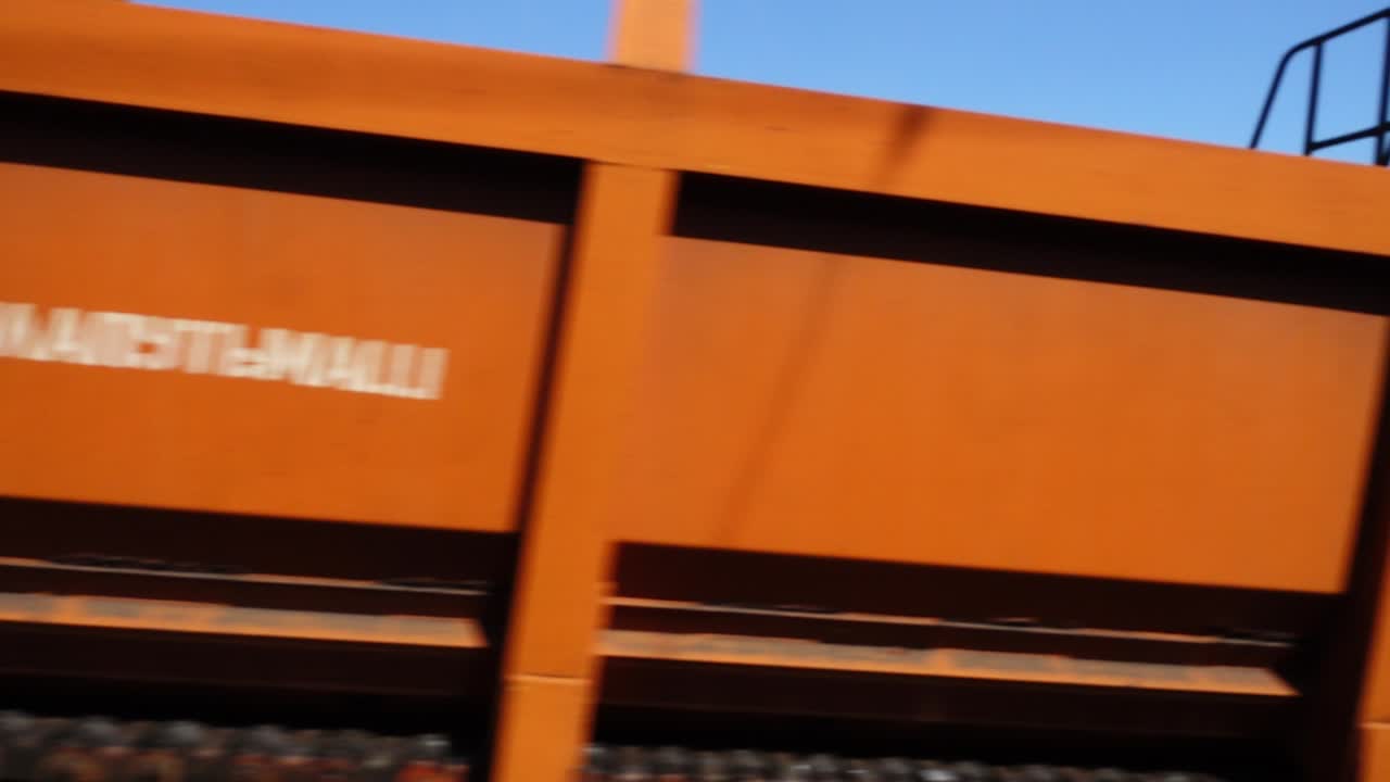 Rail-laying machine. Railway tracklayers. Railroad construction. Railroad track laying machine at work. Supporting machinery on the railway line