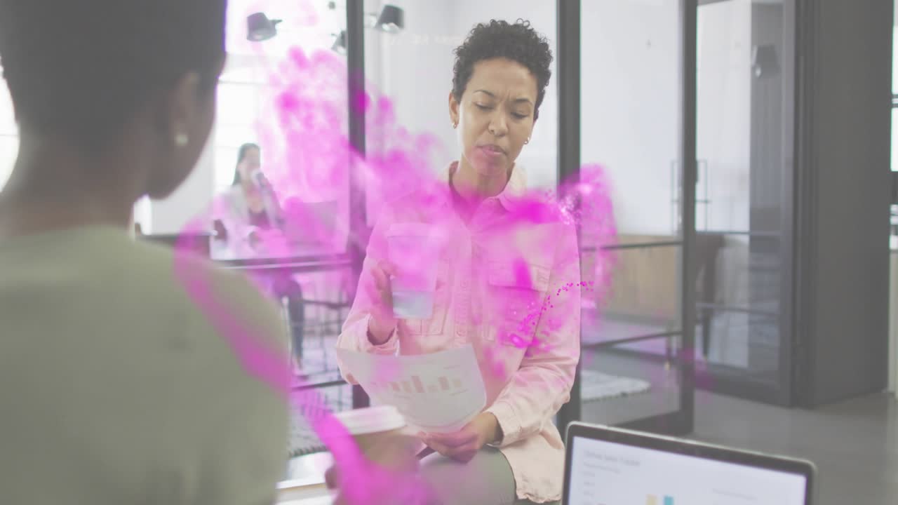 Woman analyzing chart in data meeting sparking mist around chart while sipping coffee and pointing