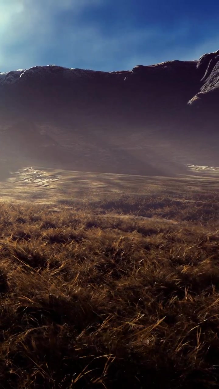 Mountain landscape with grass field and clear sky in morning light