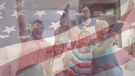 animation of american flag over happy caucasian family watching tv together at home