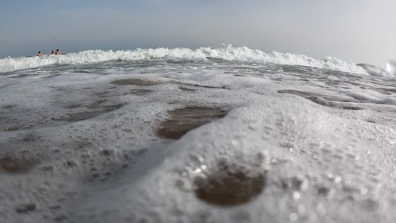 Waves hitting the shore on the beach
