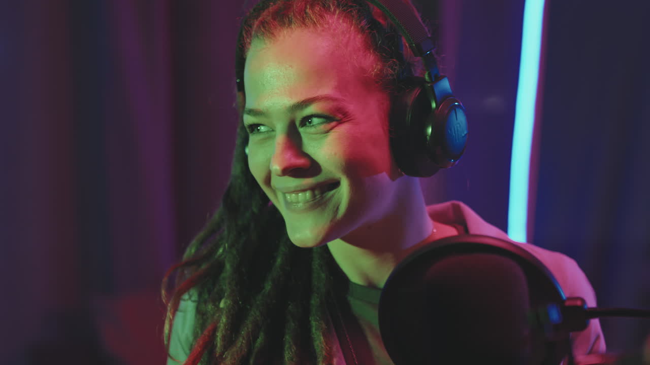 Happy Young Woman Talking on Podcast