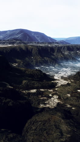 dramatic mountain landscape: dark valley and rugged peaks