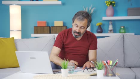 Home-office-worker-looking-at-camera-and-making-positive-gesture.