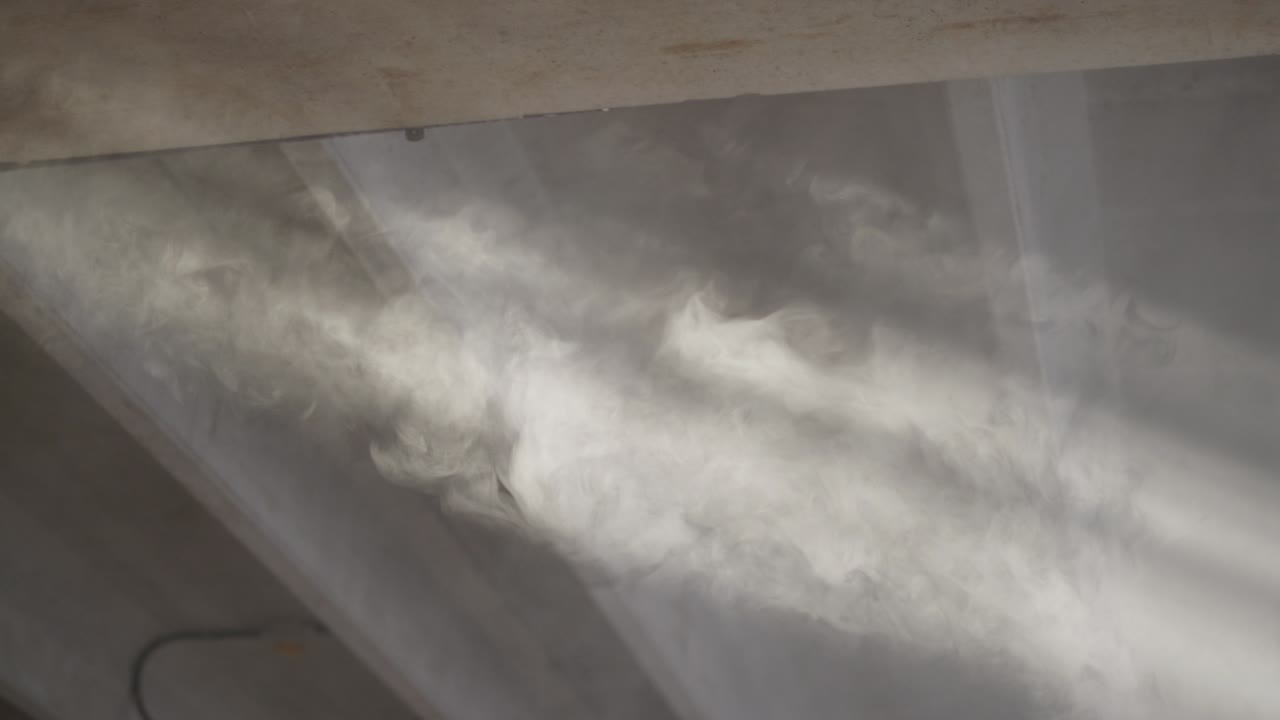 Soft sunbeams shining through dusty windows inside an abandoned industrial ambient.