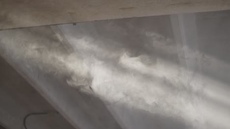 soft sunbeams shining through dusty windows inside an abandoned industrial ambient.