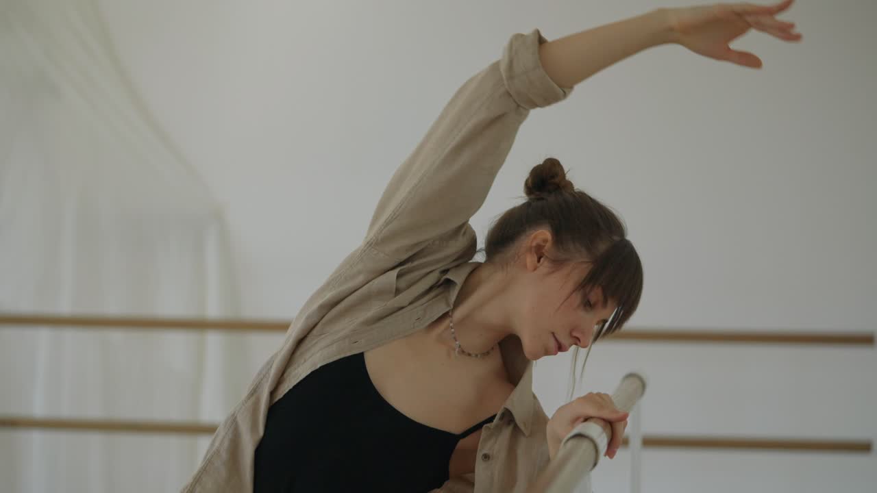 Woman dancing at the barre