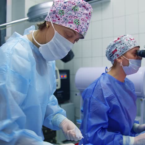 surgeon operating patient eye