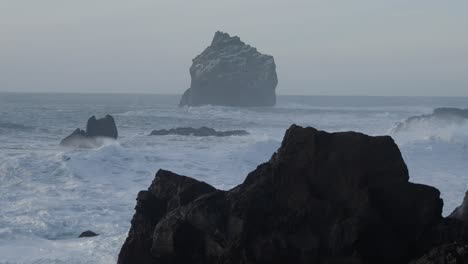 mighty dark rock formations on peninsula reykjanes in iceland, dramatic storm scene