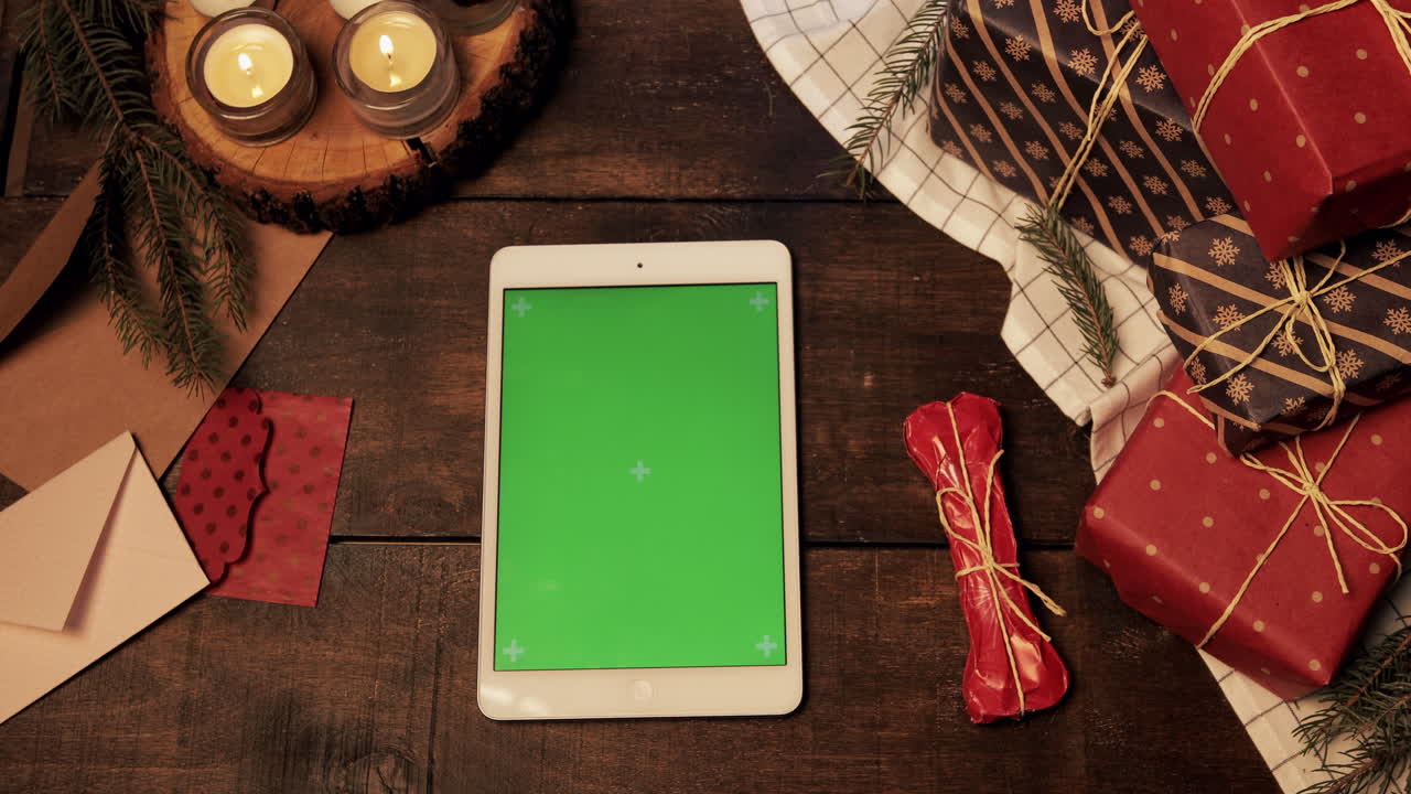 Christmas gifts and iPad on a wooden table